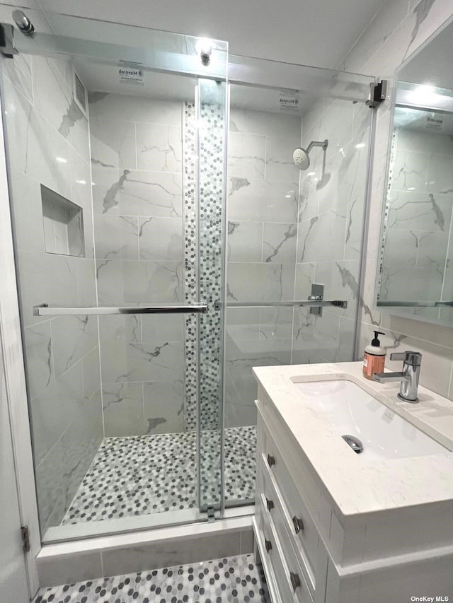 bathroom with vanity, tile patterned floors, and walk in shower