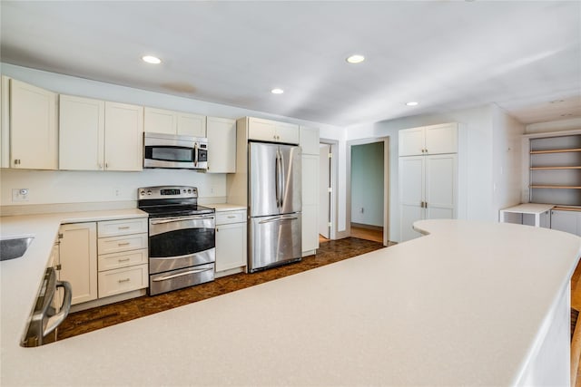 kitchen with white cabinetry and stainless steel appliances