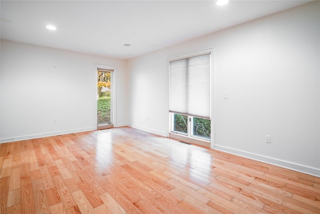 empty room with light hardwood / wood-style floors