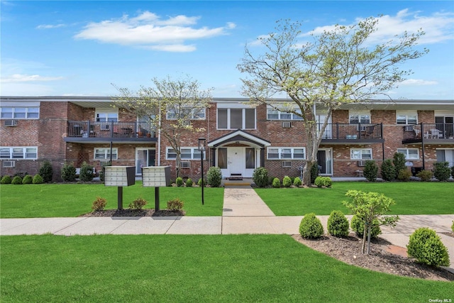 view of property with a front lawn