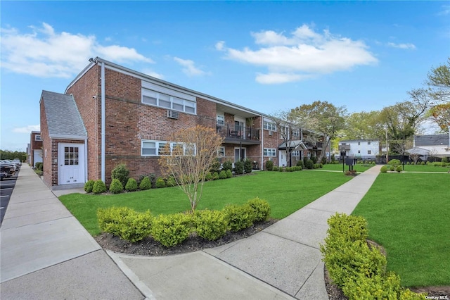 view of community featuring a lawn