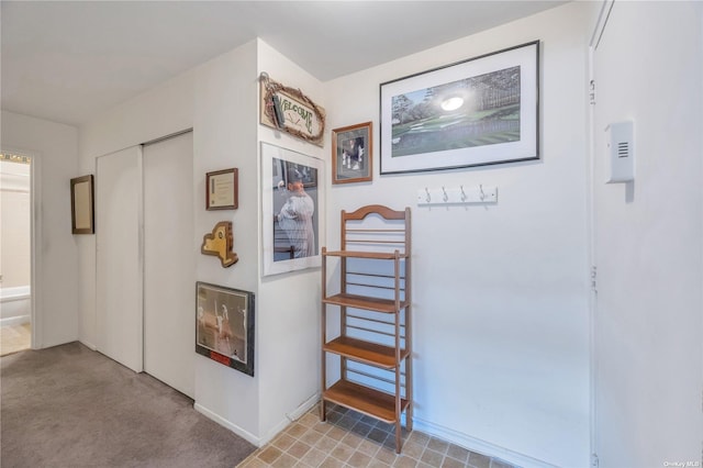 hallway with light carpet