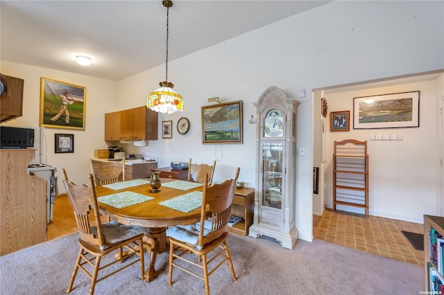 dining room featuring light colored carpet