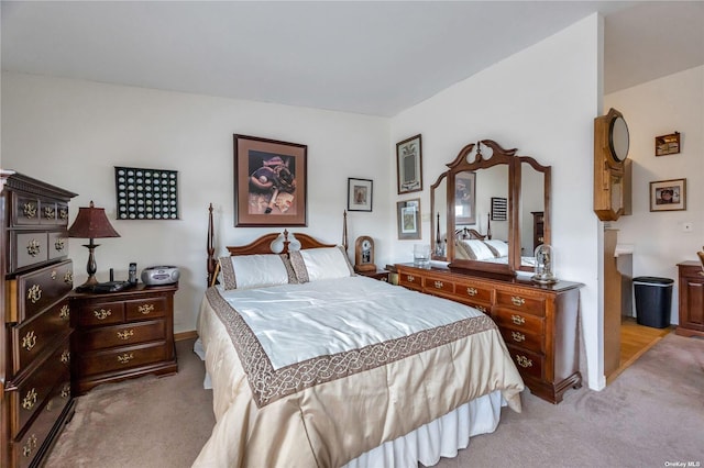 bedroom featuring light carpet