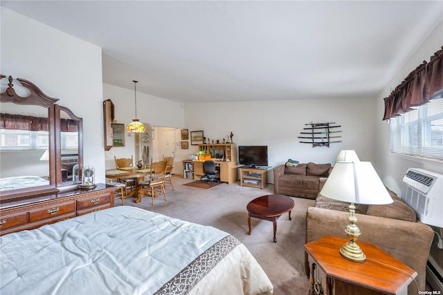 carpeted bedroom featuring an AC wall unit