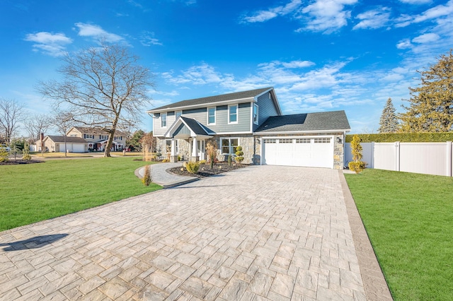 view of property with a garage and a front yard