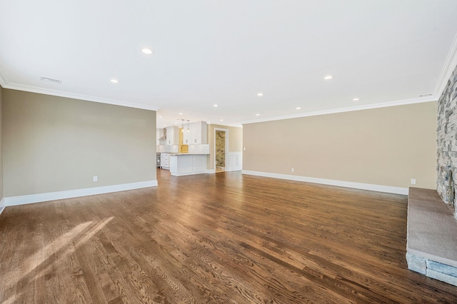 unfurnished living room with a stone fireplace, hardwood / wood-style floors, and ornamental molding