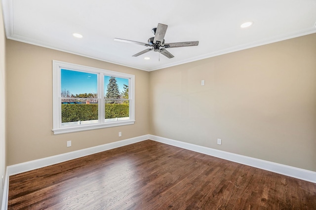 spare room with dark hardwood / wood-style floors, ceiling fan, and ornamental molding