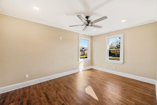 spare room featuring hardwood / wood-style flooring, ceiling fan, and ornamental molding