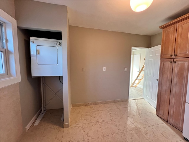 laundry area with cabinets