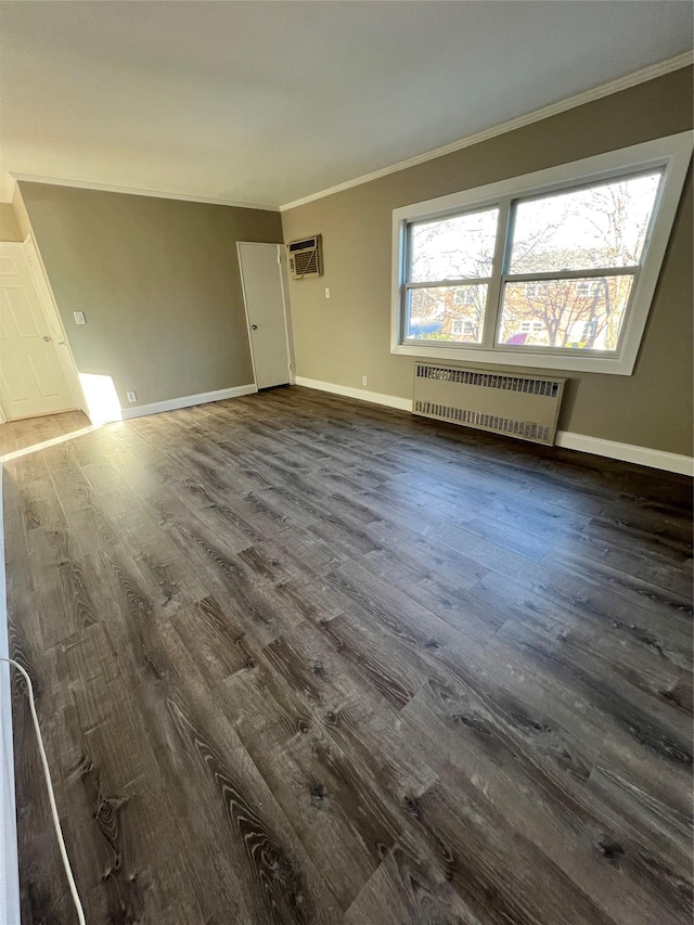 interior space featuring a wall mounted AC, dark hardwood / wood-style flooring, radiator, and crown molding