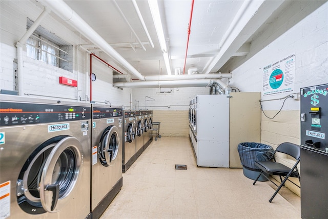 clothes washing area with separate washer and dryer