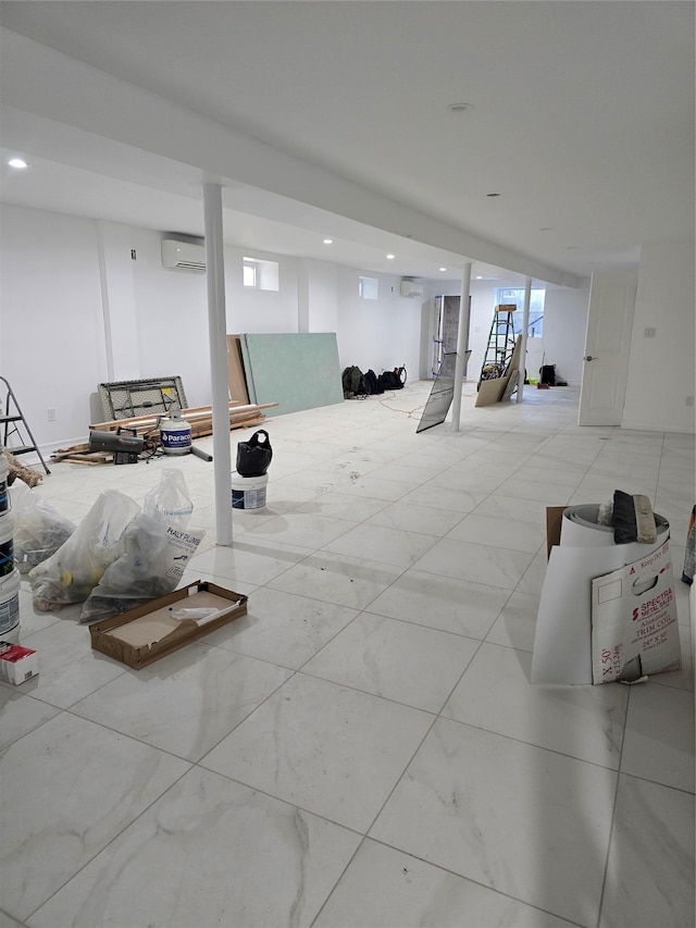 basement featuring an AC wall unit