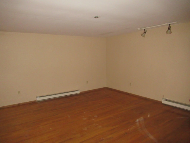 9 Jim Ln, Putnam Valley, NY 10579 - spare room featuring baseboard heating and wood finished floors
