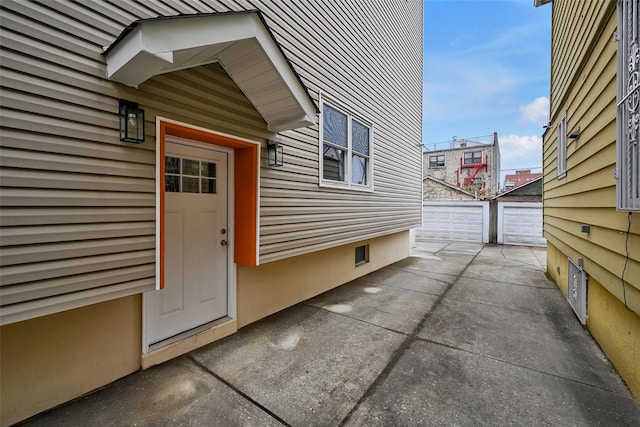 view of home's exterior featuring an outbuilding and a garage