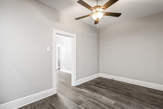 empty room with ceiling fan and dark wood-type flooring