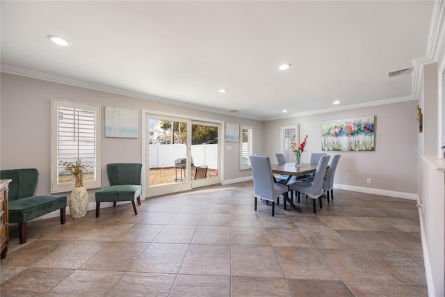 dining area featuring crown molding