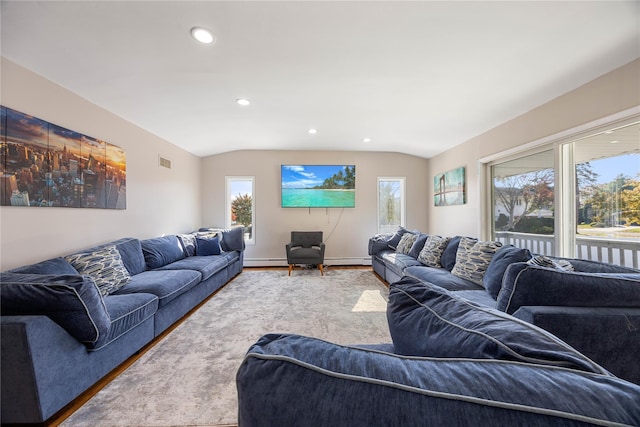 living room with a baseboard radiator, lofted ceiling, and wood-type flooring