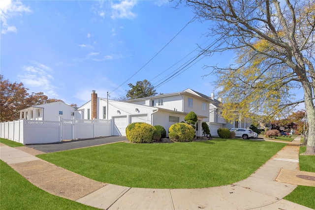 view of side of property with a lawn