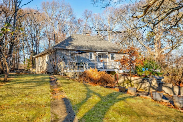 exterior space with a deck and a yard