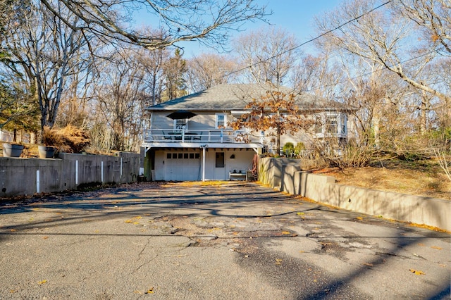 view of front of home with a garage and a deck