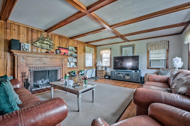 living room with cooling unit, coffered ceiling, a fireplace, wood-type flooring, and beamed ceiling