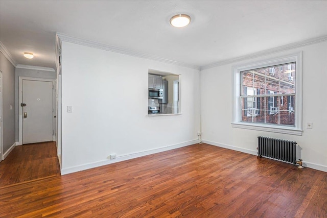 unfurnished room featuring radiator heating unit, dark hardwood / wood-style floors, and ornamental molding