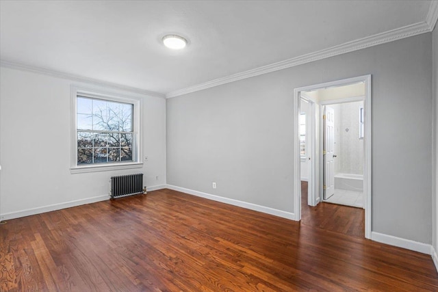 empty room with radiator, crown molding, and dark hardwood / wood-style floors