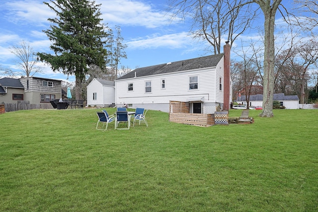 back of house featuring a lawn