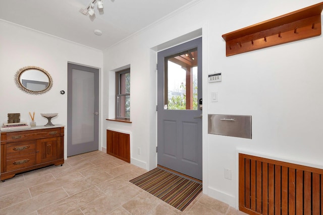 doorway featuring ornamental molding