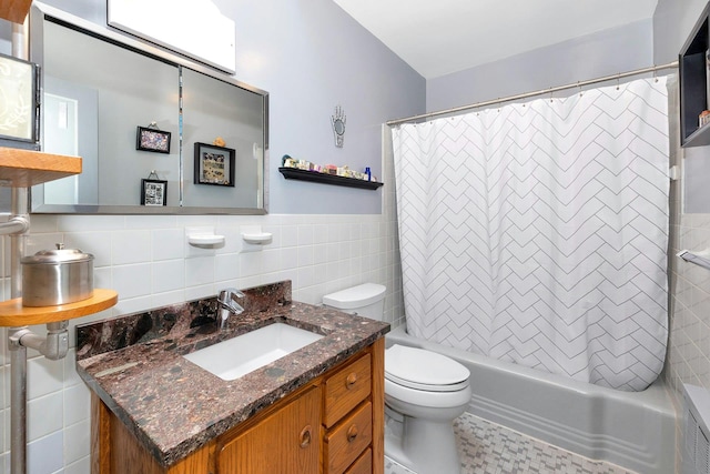 full bathroom featuring vanity, tile walls, shower / bath combination with curtain, and toilet