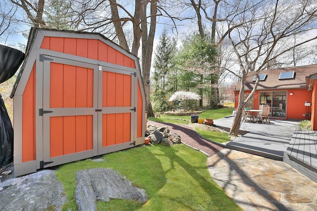 view of outbuilding with a yard