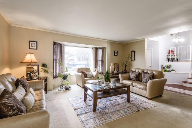 living room featuring carpet flooring, ornamental molding, and a chandelier