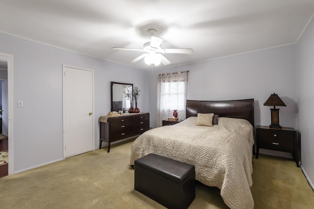 bedroom with ceiling fan and light carpet