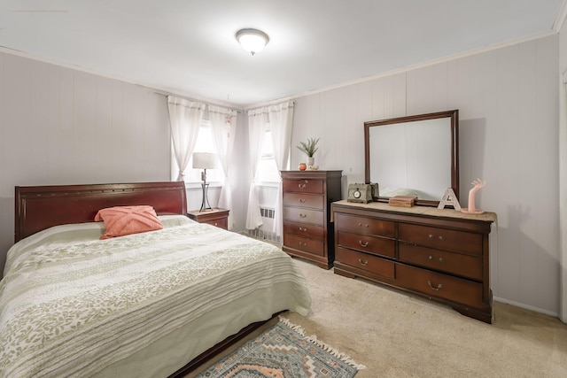 bedroom with light colored carpet and crown molding