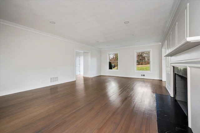 unfurnished living room with ornamental molding, dark wood-type flooring, and a premium fireplace