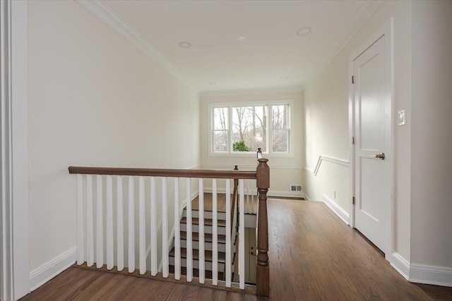 corridor featuring dark hardwood / wood-style floors and ornamental molding