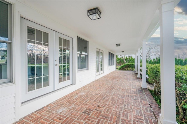 view of patio featuring french doors and covered porch