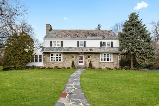 view of property with a front lawn