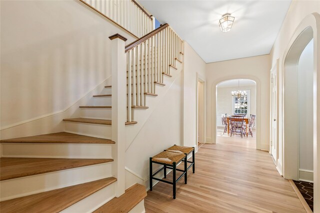 staircase with wood-type flooring