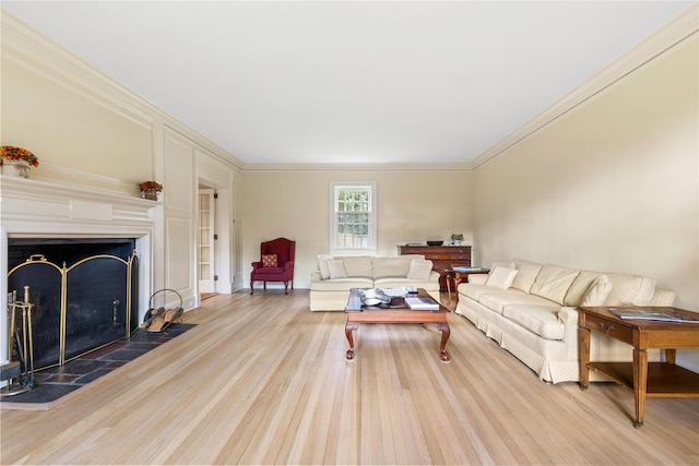 living room with light wood-type flooring and crown molding