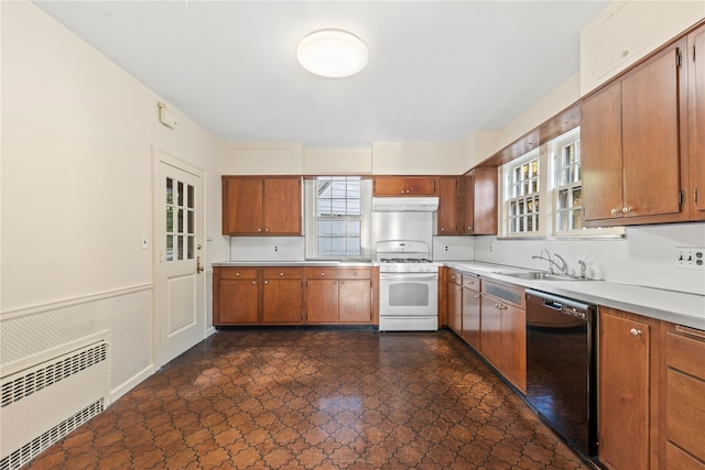 kitchen featuring radiator heating unit, dishwasher, white gas stove, and sink