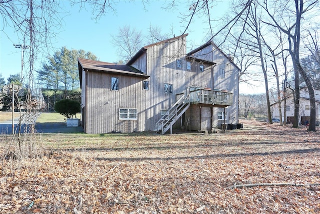 back of house with a deck