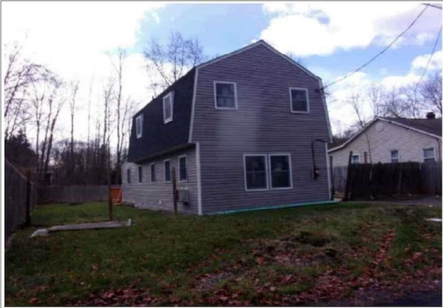 view of home's exterior with a lawn