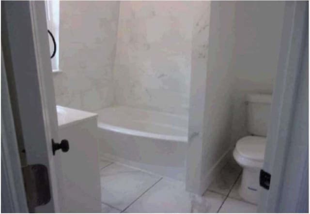 bathroom featuring toilet