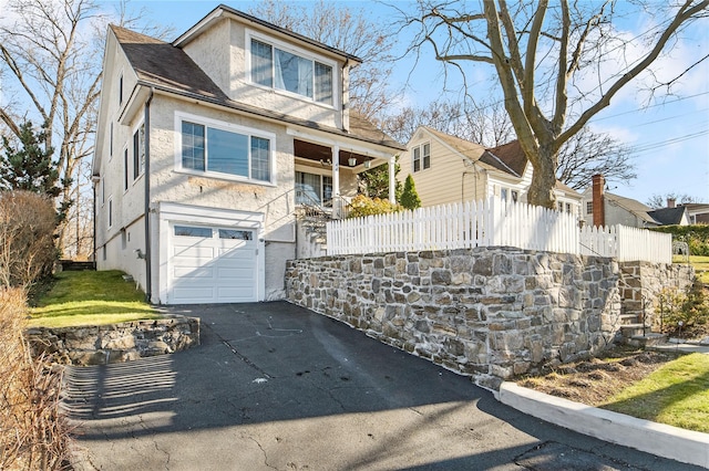 view of front of property with a garage