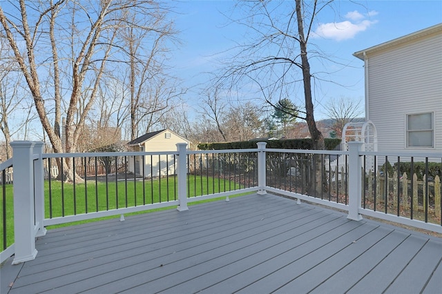 wooden deck with a yard