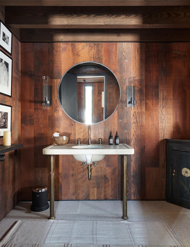 bathroom with wood walls