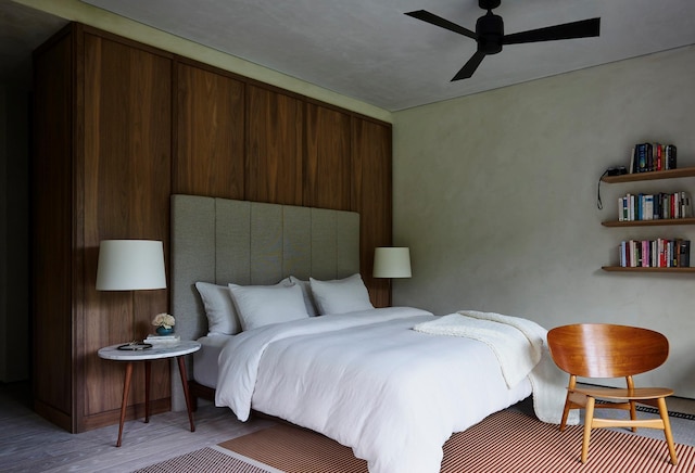 bedroom featuring hardwood / wood-style floors and ceiling fan