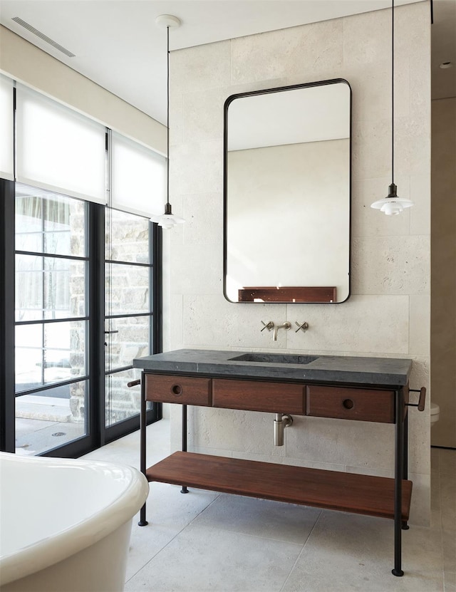 bathroom with vanity and concrete floors